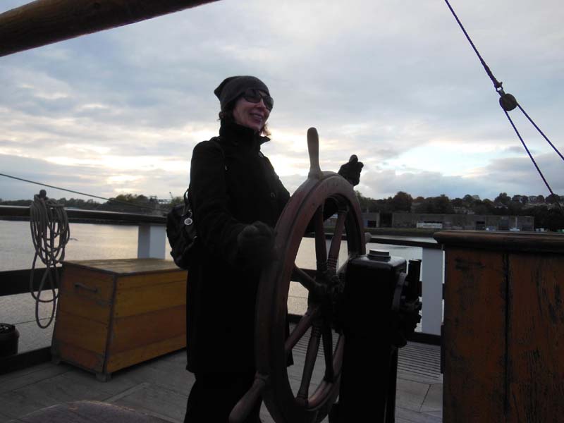 089Sue_at_the_helm_of_Dunbrody_ship_replica