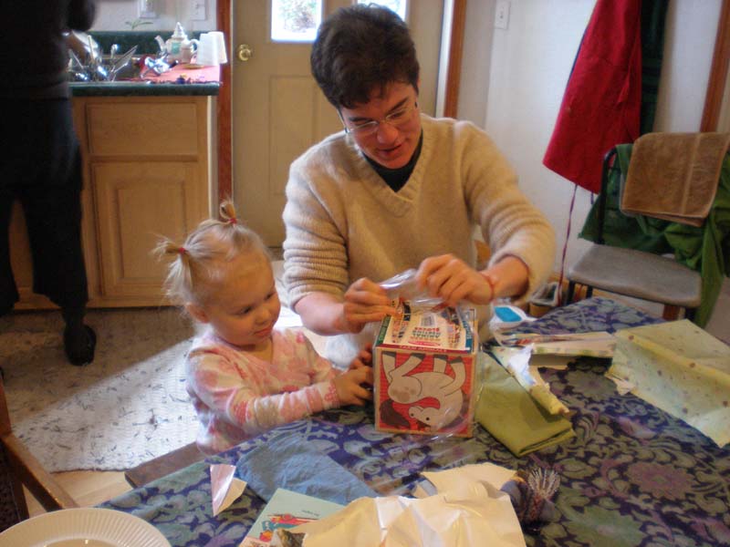 33Amy_Kayla_unwrap_present